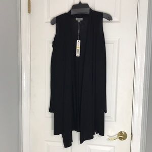 Joseph A black long sleeve, open shoulder sweater.